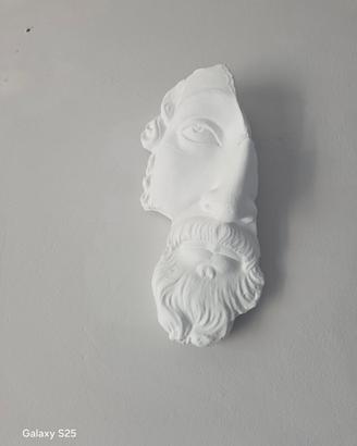 Applique raffigurante volto 