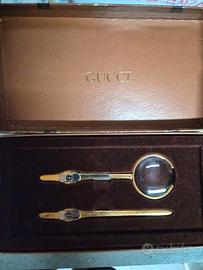 lente di ingrandimemto e tagliacarte gucci