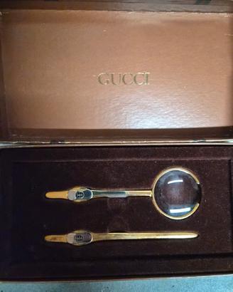 lente di ingrandimemto e tagliacarte gucci