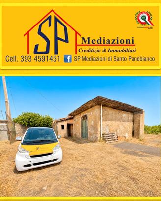 Ampio terreno pianeggiante con fabbricati