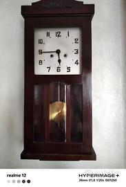 Orologio pendolo a muro