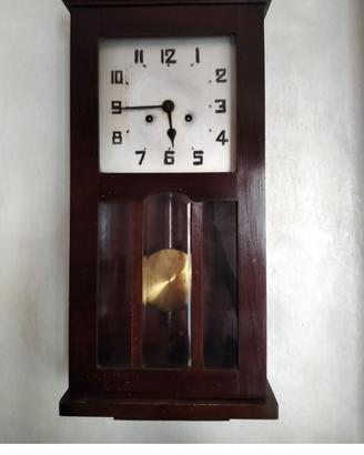 Orologio pendolo a muro