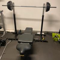 Set panca piana Technogym, rack, bilanciere dischi
