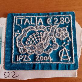 FRANCOBOLLO IN TESSUTO RICAMATO
