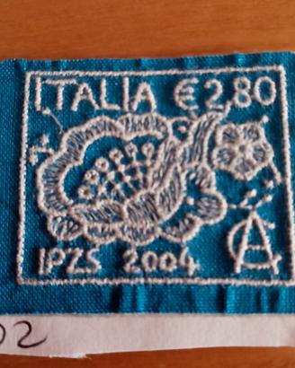 FRANCOBOLLO IN TESSUTO RICAMATO