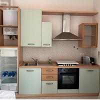 cucina in legno e acciaio completa di elettrodomes