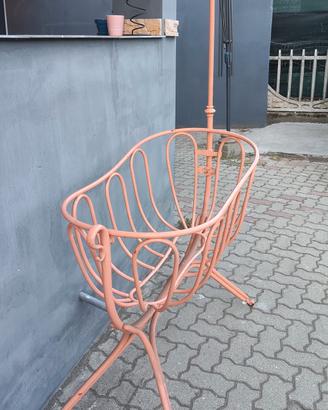 culla a dondolo in ferro con ruote