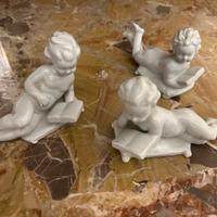 Soprammobile puttini in ceramica