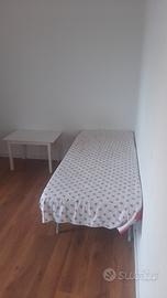 Bed in a single room