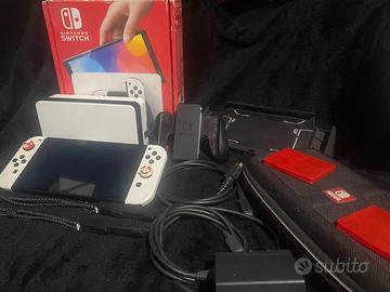 Nintendo Switch Oled completa di accessori