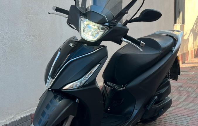 Kymko People 125s + Caschi LS2