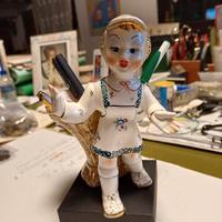 Bambolina con gerla Tosin.