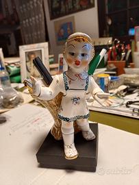 Bambolina con gerla Tosin.