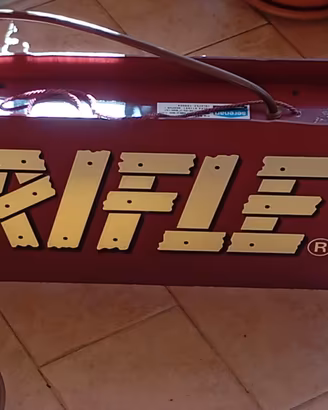 Insegna luminosa rifle