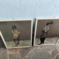 Coppia specchi decorati.