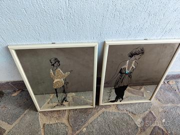 Coppia specchi decorati.