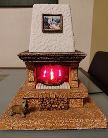 CAMINETTO IN PIETRA CON FIAMMA 