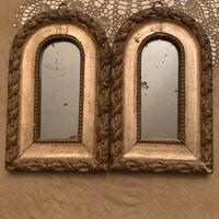 Coppia specchi in legno dorato del Settecento.