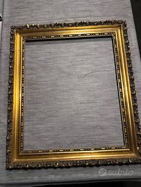 cornice anni 70 in legno con finiture dorate