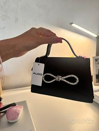 Mini borsetta nera Aldo con fiocco brillantinato