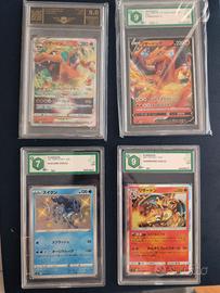 lotto carte Pokemon gradate Charizard suicune