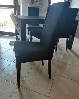 sedie nere in ecopelle  e copertura elasticizzata