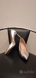 Scarpe argento coi tacchi effetto specchio