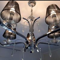 Lampadario in acciaio lucidato