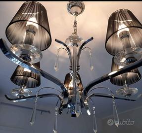 Lampadario in acciaio lucidato