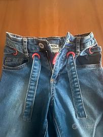 Jeans bimba con cinturino in tessuto