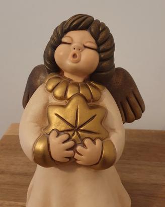 Angelo Thun con stella di Natale oro