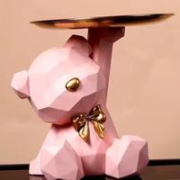 Orso in resina rosa con fiocco e vassoio dorato |