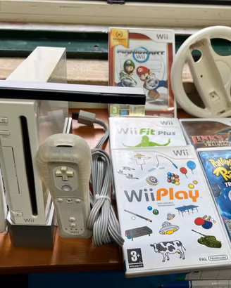 Nintendo Wii completa di tutto , volante 5 giochi
