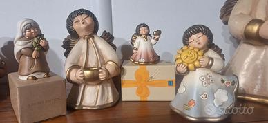 Thun angeli e donna con ulivo