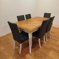 Tavolo allungabile bicolore e sedie imbottite