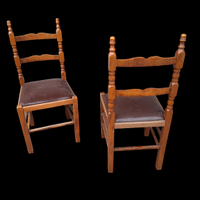 Set di due sedie in legno con seduta imbottita.  -