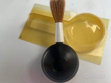 Pennellino pulisci lenti