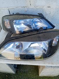 coppia fari Opel Astra G