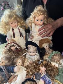 12 bambole di collezione in porcellana