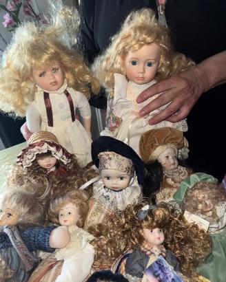 12 bambole di collezione in porcellana