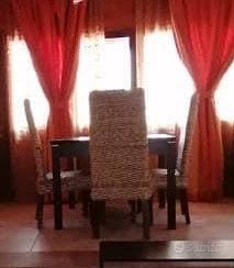 Tavolo allungabile con sedie in rattan