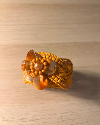 Bracciale arancione con fiore