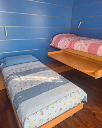 Cameretta salvaspazio con letto scorrevole