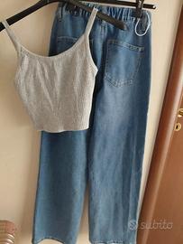Top grigio e jeans blu