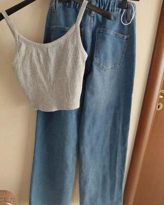 Top grigio e jeans blu