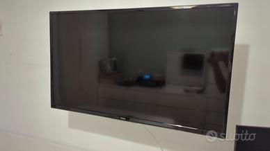 TV Haier 40" + braccio per sostegno a muro