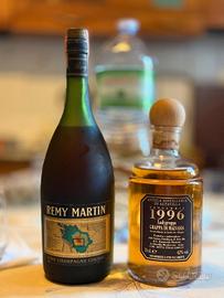 2 bottiglie: Remy Martin e Grappa di Malvasia