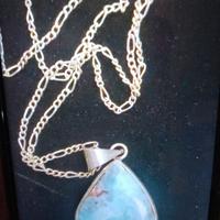 çollana con ciondolo 