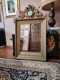 Specchiera anticacon orologio.