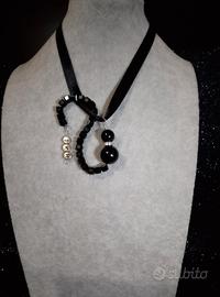 ciondolo a forma di gatto